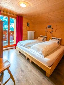 Vuode tai vuoteita majoituspaikassa Luxueux Chalet au centre de Champéry vue panoramique