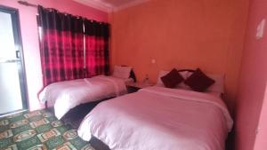 Postel nebo postele na pokoji v ubytování Hotel Pigeon Prince