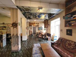 a living room with a couch and a table at Yo Ho Hostel in Varna City