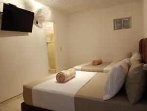 Letto o letti in una camera di Hotel Aerocafe Pereira