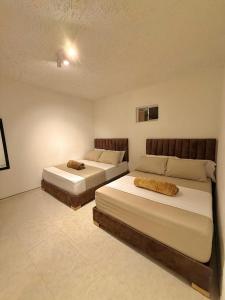 Letto o letti in una camera di Hotel Aerocafe Pereira
