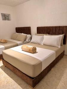 Letto o letti in una camera di Hotel Aerocafe Pereira