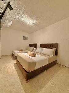 Postel nebo postele na pokoji v ubytování Hotel Aerocafe Pereira