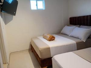 Letto o letti in una camera di Hotel Aerocafe Pereira