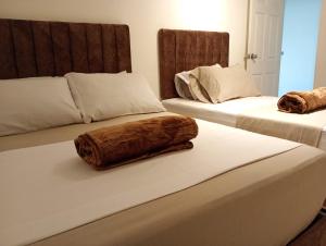 Letto o letti in una camera di Hotel Aerocafe Pereira