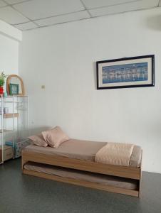 Ένα ή περισσότερα κρεβάτια σε δωμάτιο στο Bajet Homestay - Teratak Singgah