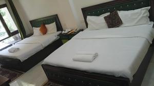 Postel nebo postele na pokoji v ubytování Kempty Lake Resort