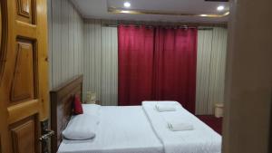 Postelja oz. postelje v sobi nastanitve Black Stone Suites Skardu