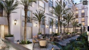 an image of a hotel lobby with palm trees at Kadun Hotel Boutique in Cabo San Lucas