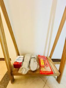 a wooden shelf with items on it in a room at Home in Old Quarter HÀ NỘI - Ta Hien street in Hanoi