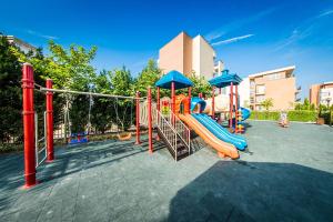 a playground with a slide in a park at Orient Holiday in Sunny Beach