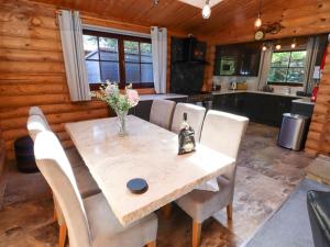 a kitchen and dining room with a table and chairs at Starwood in Morpeth