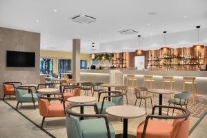 Televízia a/alebo spoločenská miestnosť v ubytovaní Danubius Hotel Bük