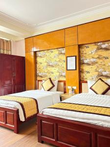 Postel nebo postele na pokoji v ubytování Hải Vân Hotel Điện Biên