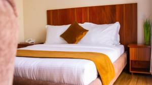 Postel nebo postele na pokoji v ubytování Flamarc Hotel