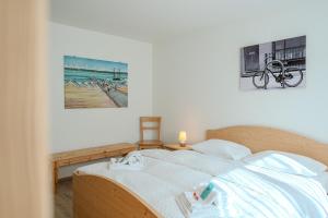 Postel nebo postele na pokoji v ubytování Sunnaschy Heidi by Arosa Vacations
