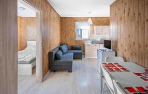 a room with a couch and a bed and a kitchen at Awesome Home In Sarbinowo in Sarbinowo