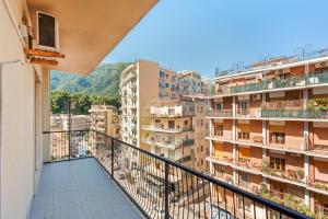 a balcony with a view of buildings at Giufrania Rooms in Castellammare di Stabia