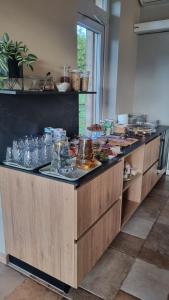 a counter in a kitchen with food on it at Resort pri Hrastu in Kamnik +30 photos