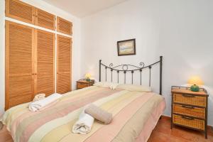 Postel nebo postele na pokoji v ubytování Carabeo 19 + 25 fotografií