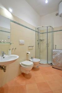 a bathroom with a toilet and a sink and a shower at Casa della Marina - beach, seaview, wifi in Conca dei Marini +12 photos