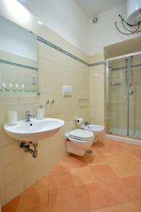 a bathroom with a toilet and a sink and a shower at Casa della Marina - beach, seaview, wifi in Conca dei Marini