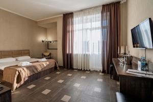Postel nebo postele na pokoji v ubytování Hotel Verhovina + 37 fotografií