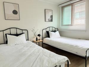 Katil atau katil-katil dalam bilik di Ogeum Stay, Songpa