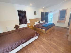 Magizham Homestay客房内的一张或多张床位