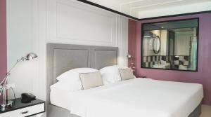 a bedroom with a white bed and a mirror at Sugar Marina Hotel - FASHION - Kata Beach in Kata Beach +37 photos