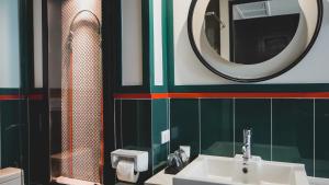 a bathroom with a sink and a mirror at Sugar Marina Hotel - FASHION - Kata Beach in Kata Beach