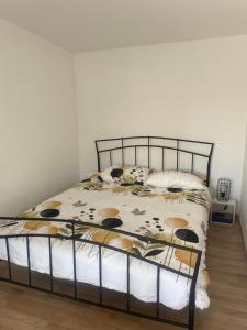 a bedroom with a bed with a metal frame at Beach house Chris in Pakoštane