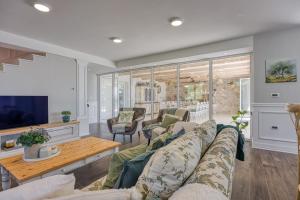 a living room with a couch and a table at VILLA PRISUNAC - private luxury with amazing sea view between Istria and Kvarner in Zagorje