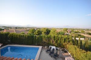 a villa with a swimming pool and a view at La casa de las golondrinas in Tángel +39 photos