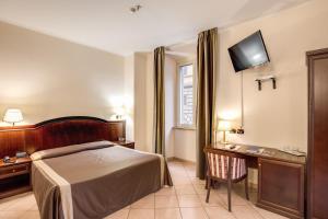 Säng eller sängar i ett rum på Hotel San Marco