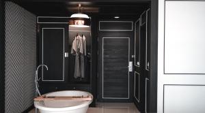 a bathroom with a toilet and a black wall at Sugar Marina Hotel - FASHION - Kata Beach in Kata Beach