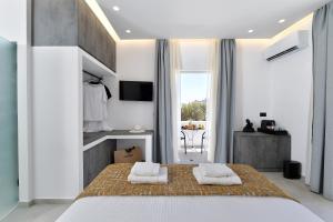 Ένα ή περισσότερα κρεβάτια σε δωμάτιο στο Ξενοδοχείο Γιάννα