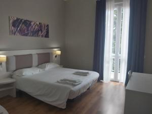 Postel nebo postele na pokoji v ubytování Lodges le Mura