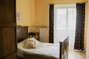 Postel nebo postele na pokoji v ubytování Apartamenty Optimal