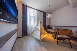 a living room with a tent in the middle of a room at Atour Hotel Beijing Haidian Qinghe MixC in Beijing