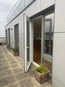 a sliding glass door on the side of a building at The Viewpoint in Brighton & Hove