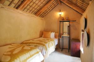 Postel nebo postele na pokoji v ubytování Hatta Village Lodges - Ophiolite