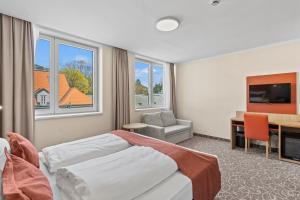 Postel nebo postele na pokoji v ubytování Hotel Schild
