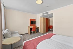 Postel nebo postele na pokoji v ubytování Hotel Schild