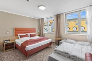 Postel nebo postele na pokoji v ubytování Hotel Schild