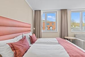 Postel nebo postele na pokoji v ubytování Hotel Schild