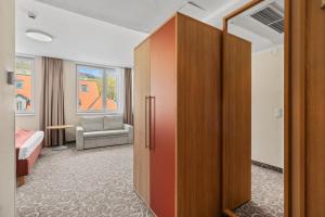 Postel nebo postele na pokoji v ubytování Hotel Schild