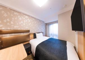Letto o letti in una camera di APA Hotel Kyoto Gion Excellent