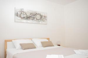Posteľ alebo postele v izbe v ubytovaní Apartmani Cimerman