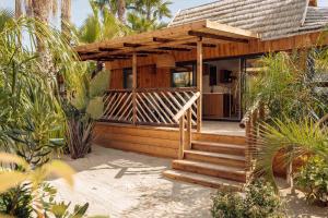 a wooden house with a staircase leading to it at Toison D'or in Saint-Tropez